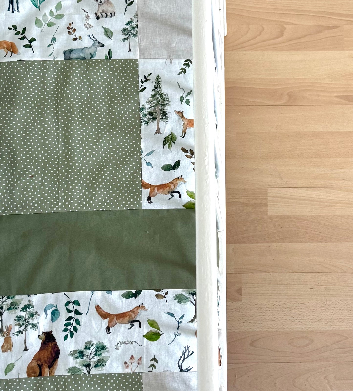 Ready to go, lightly quilted style blanket, green and beige forest animals. Soft green minky backing