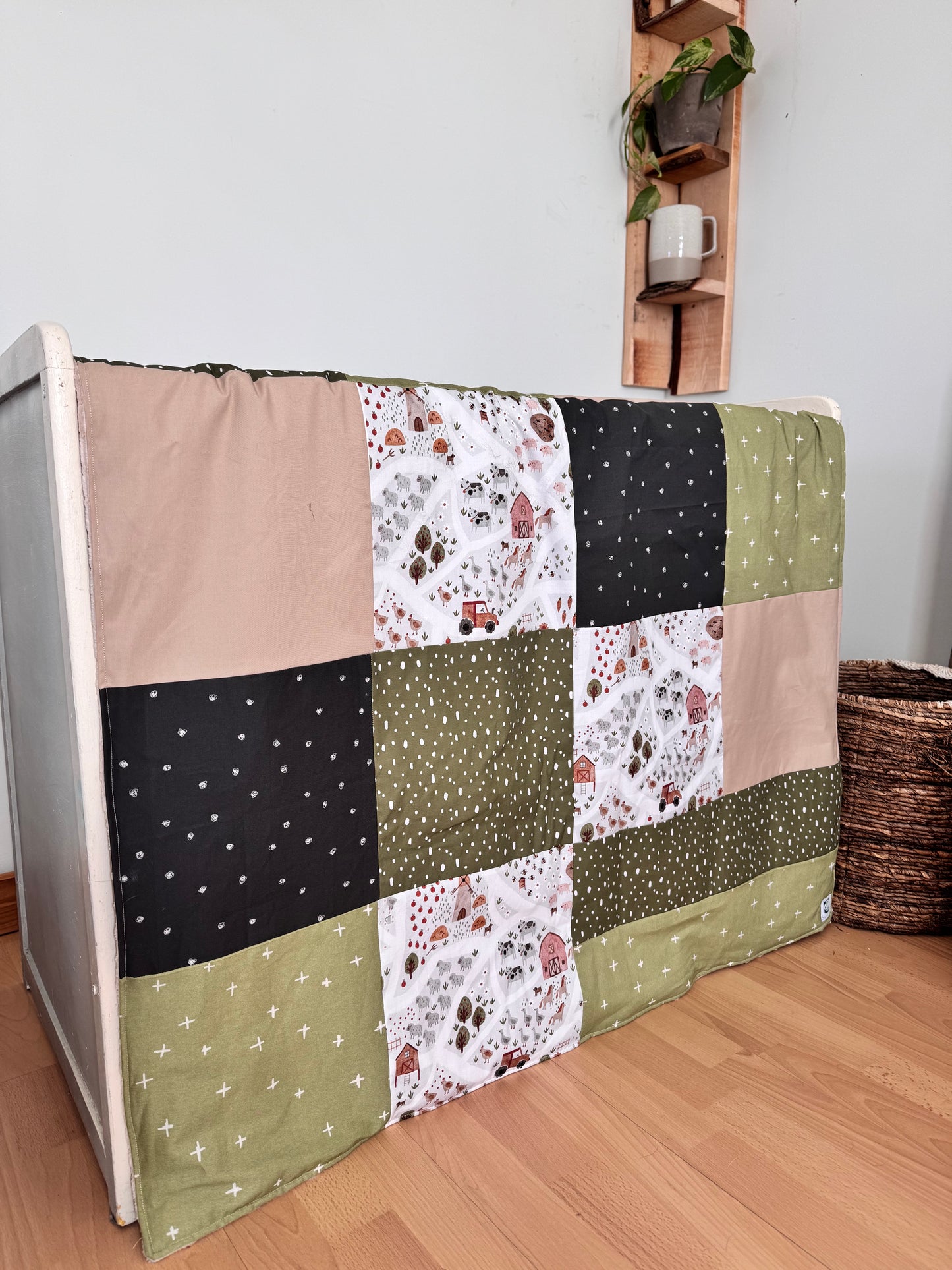 Ready to go, lightly quilted style blanket, green and beige forest animals. Soft green minky backing