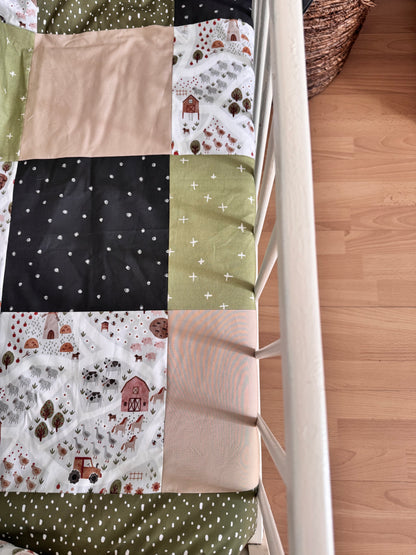 Ready to go, lightly quilted style blanket, green and beige forest animals. Soft green minky backing