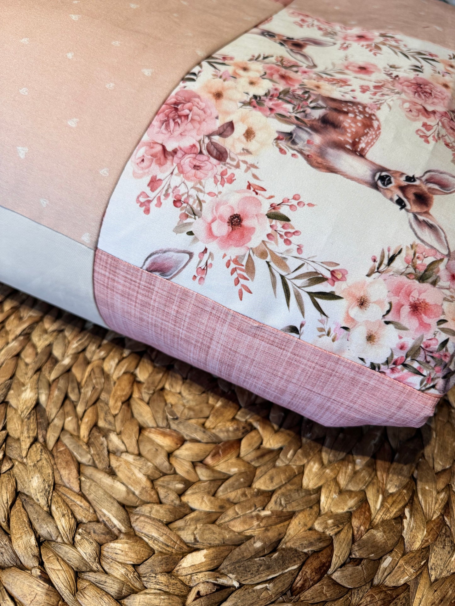 Ready to go, lightly quilted style blanket with pink and yellow floral deer print. Soft ivory minky backing